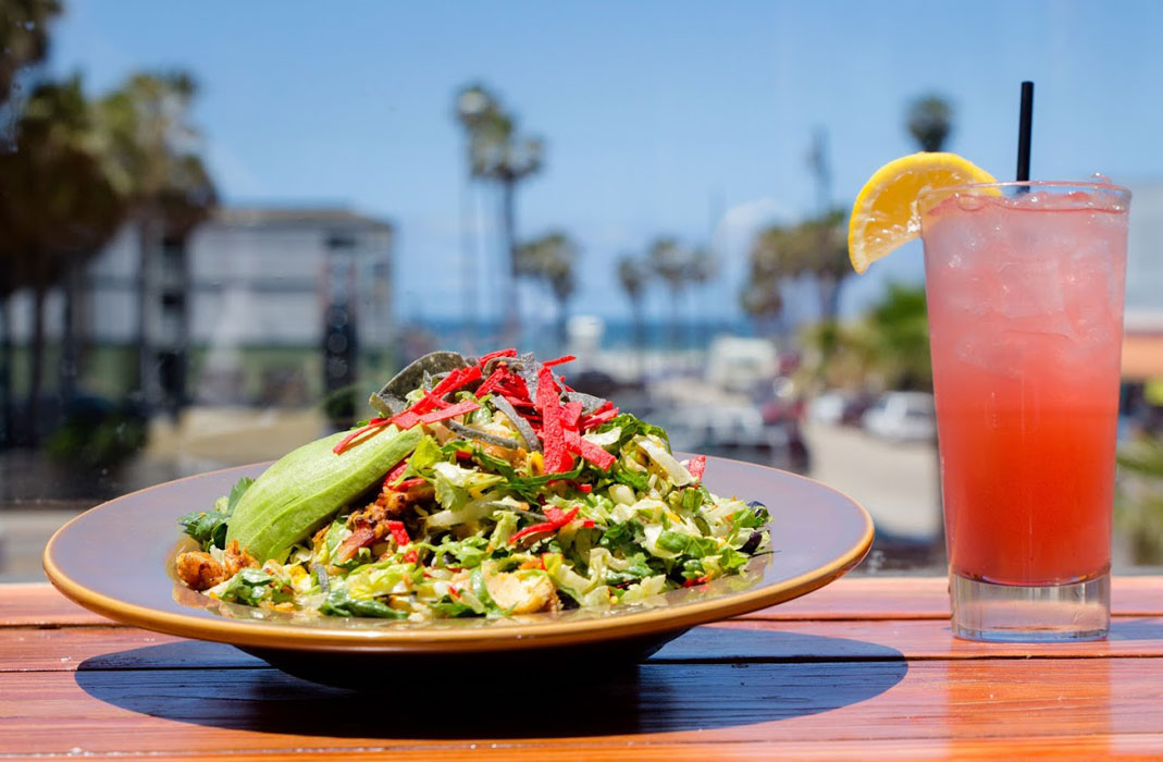 Salad and cocktail on the table